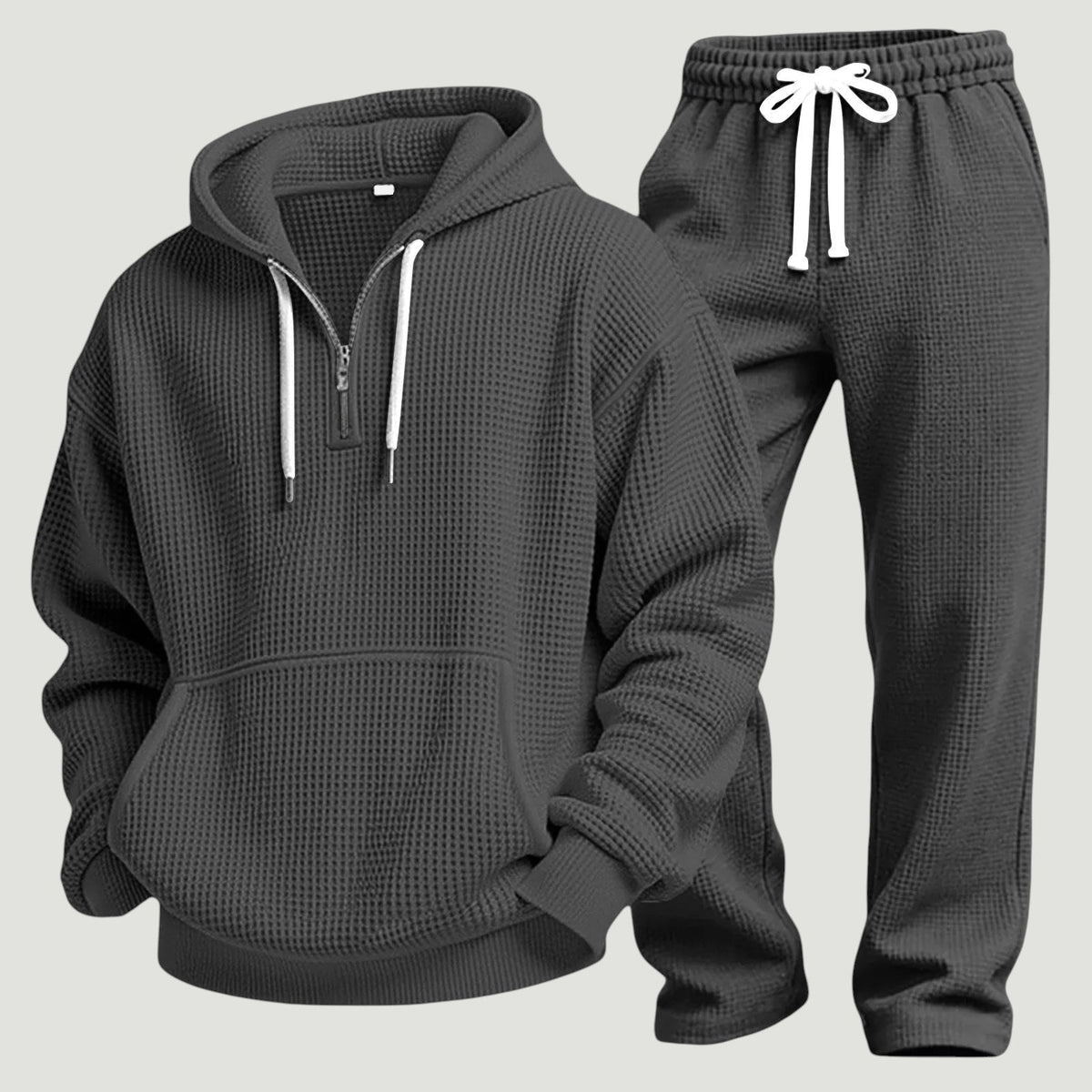 Grijs wafelstructuur trainingspak met capuchon en halve rits, los uitgestald | Boutique Moda