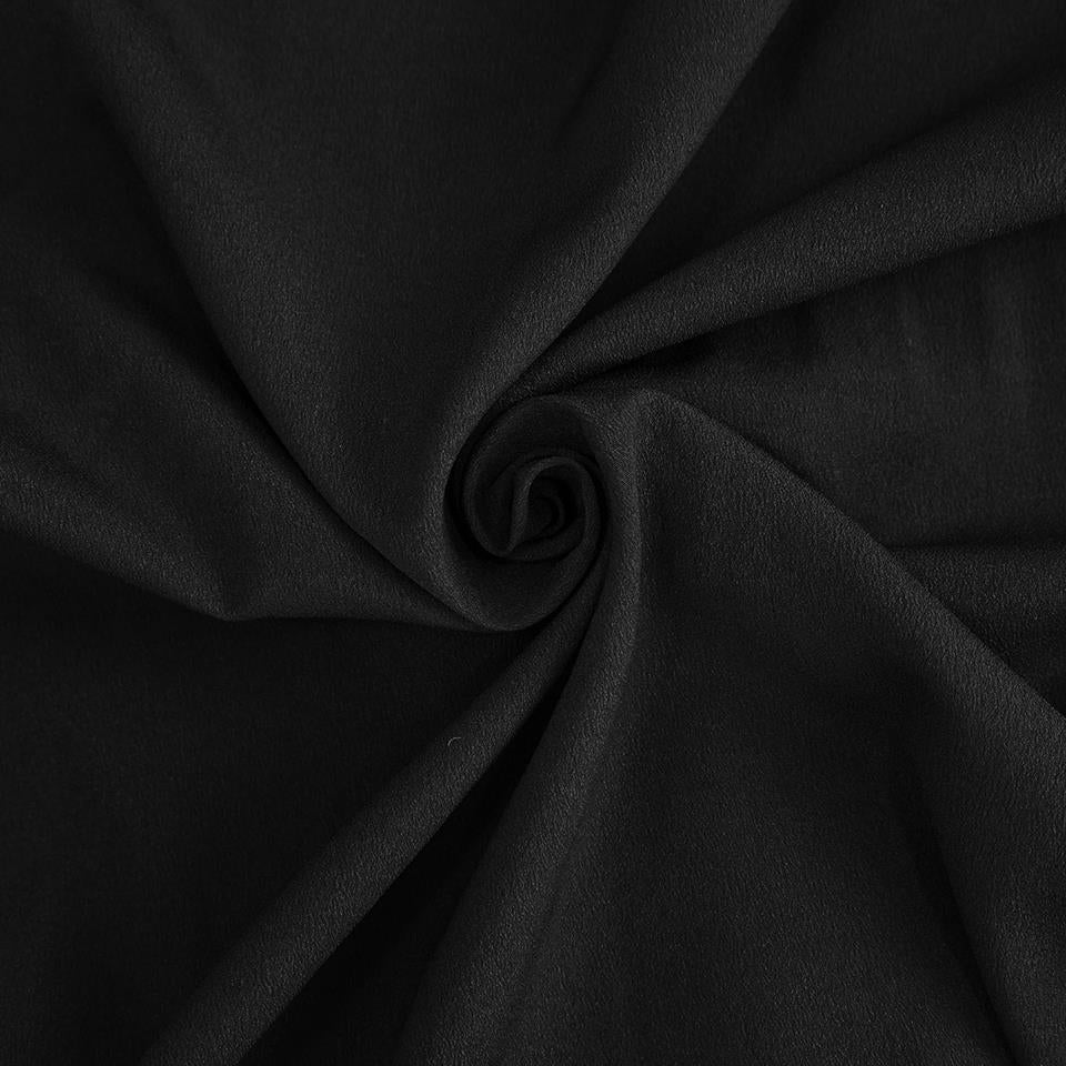 Zwarte stof met spiraalvormige draaiing, close-up van gedraaide textielstructuur zonder persoon | Boutique Moda