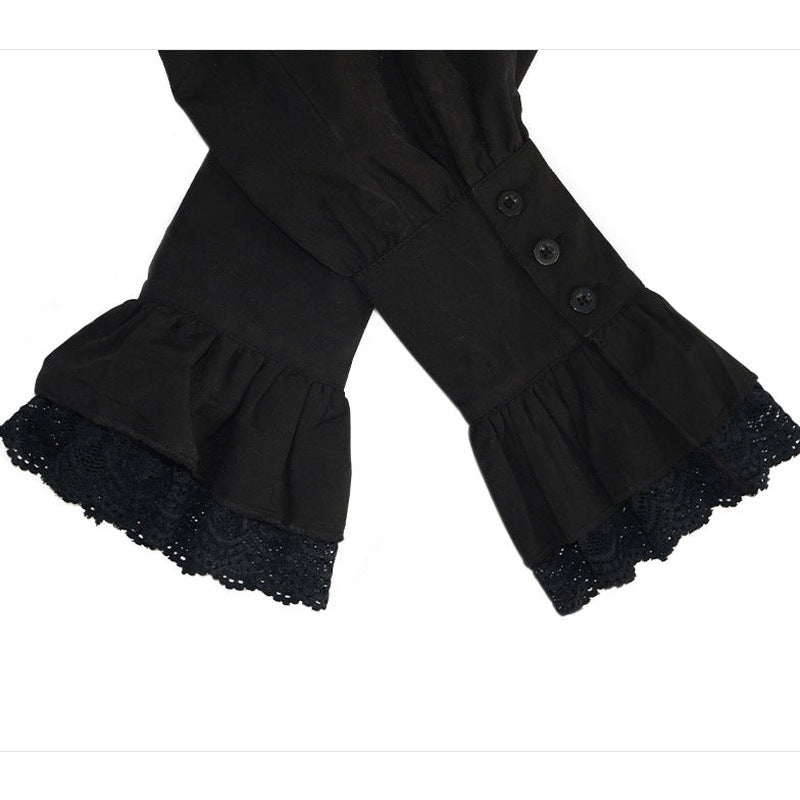 Zwarte mouw met kanten rand en knopen, close-up detail | Boutique Moda