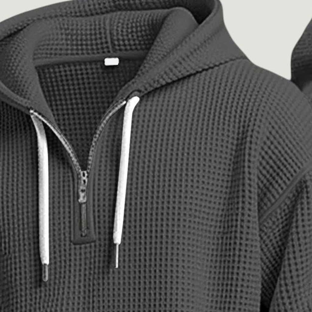 Close-up grijze wafelstructuur hoodie met halve rits en witte koordjes | Boutique Moda