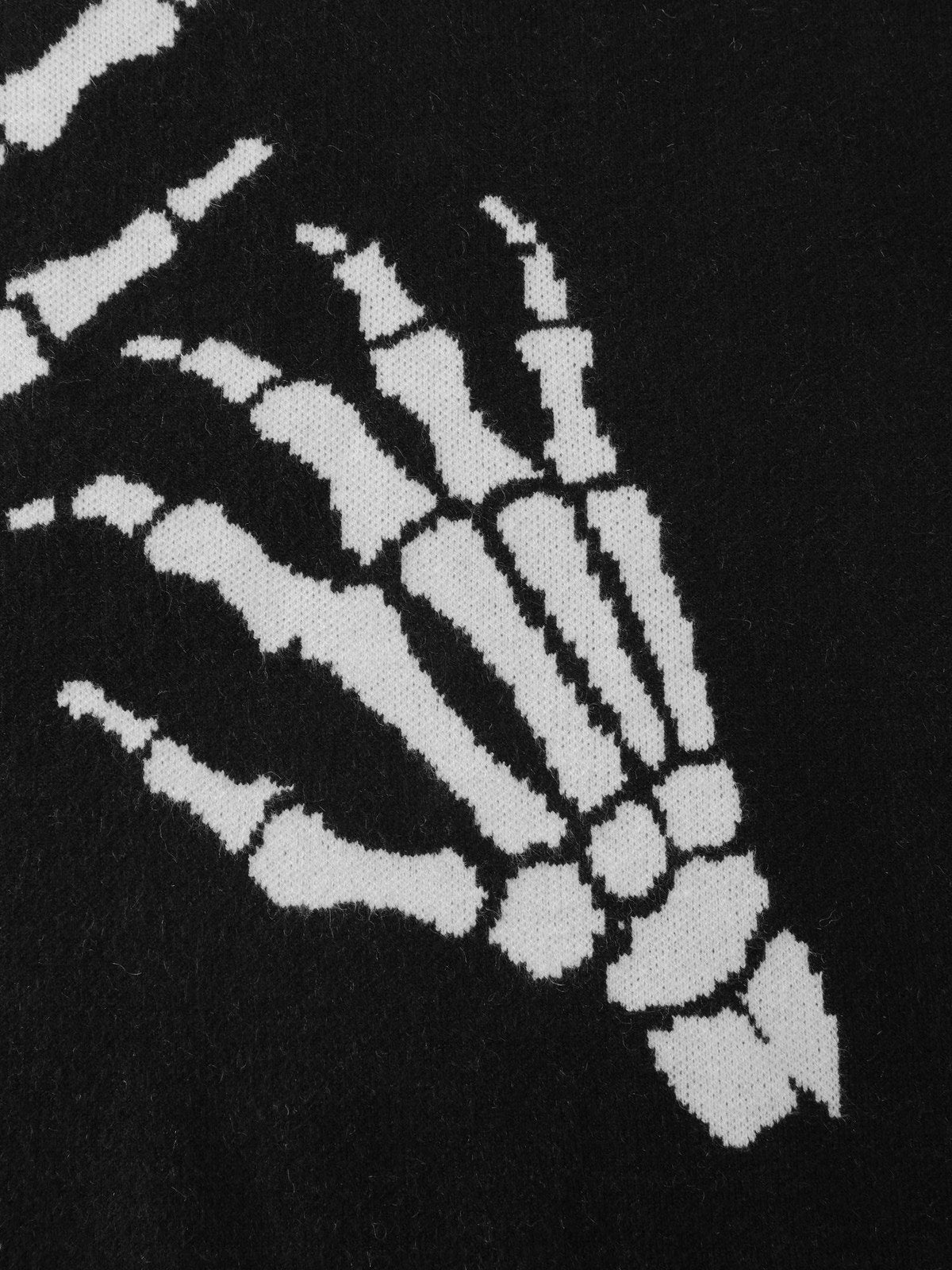 Close-up van de ingebreide skelethanden