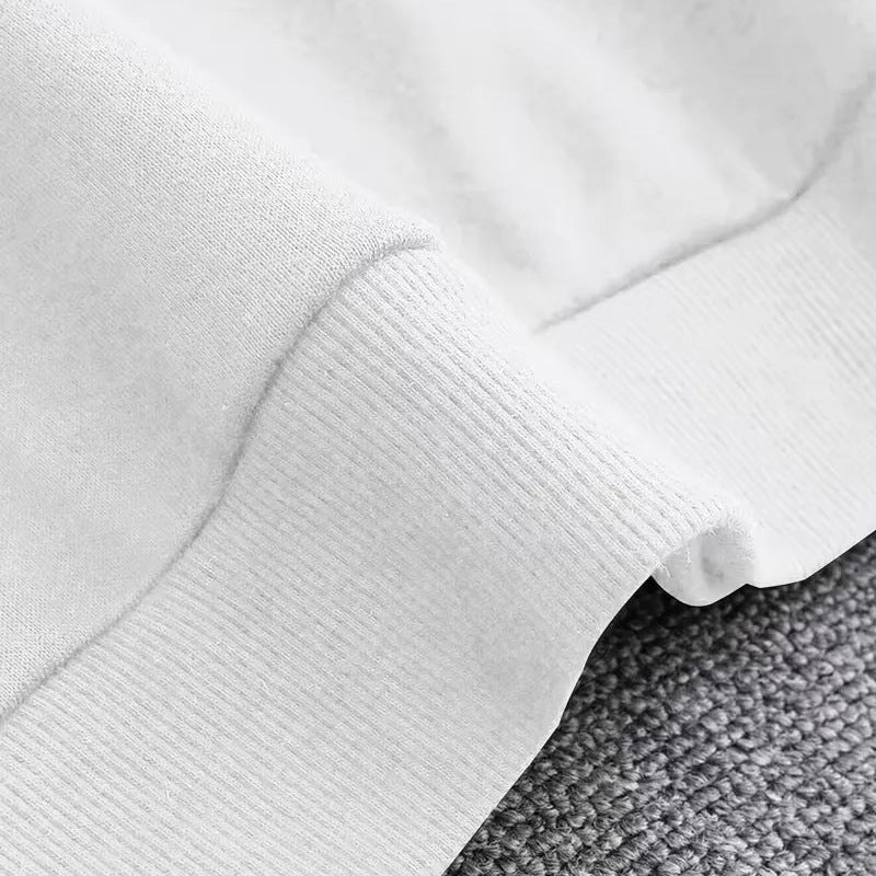 Close-up van witte geribbelde mouwboord, effen kleur, plat gefotografeerd detail | Boutique Moda